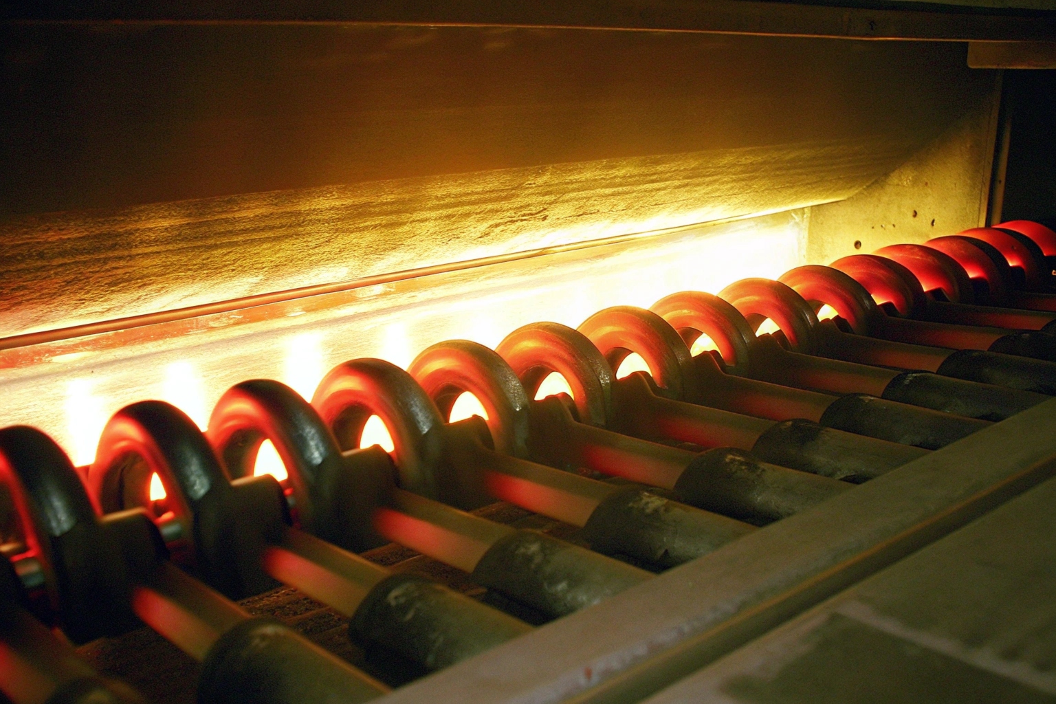 Heat treatment furnace glowing with track shoes inside