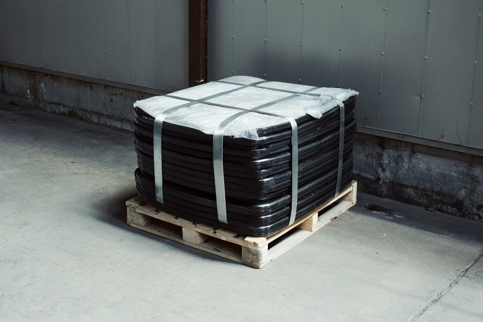 Wooden pallets with steel strapping ready for export